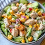 Ranch Chicken Salad on a modern marble countertop, showcasing its creamy texture with visible grilled chicken, corn, and red onion.