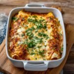 Easy Chicken Enchiladas on a modern wooden board, showcasing its golden cheesy crust with melted Monterey Jack and fresh cilantro topping.